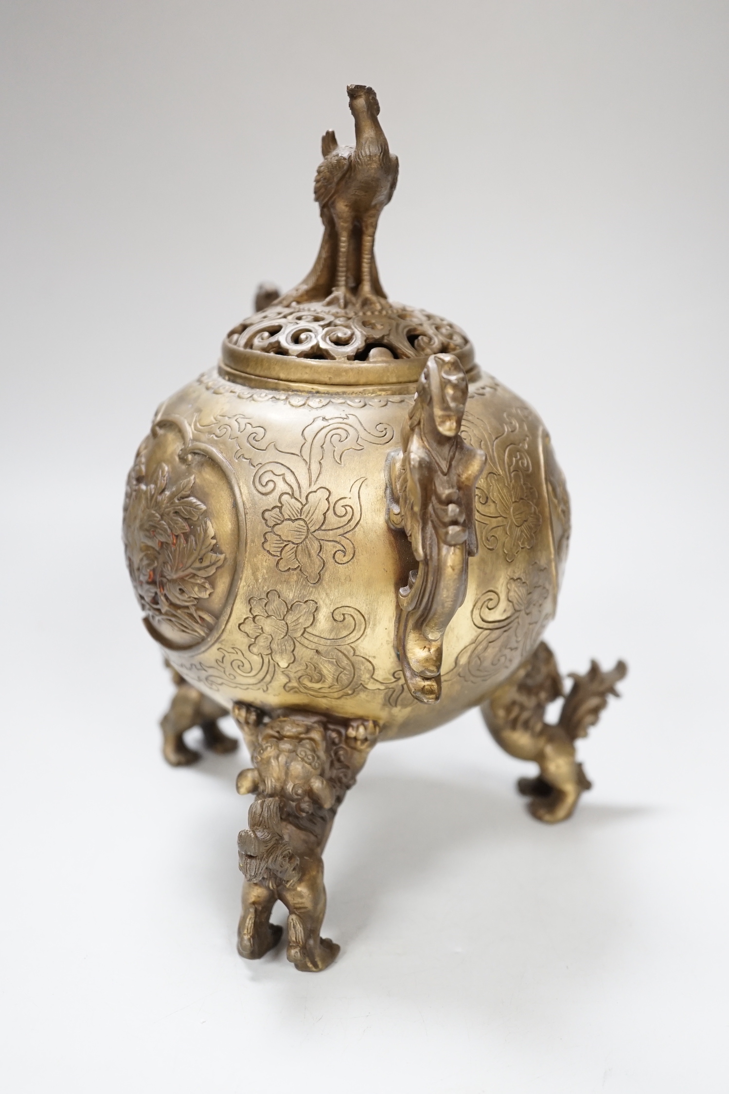 A Japanese bronze shi-shi footed censer and cover, 22cm high